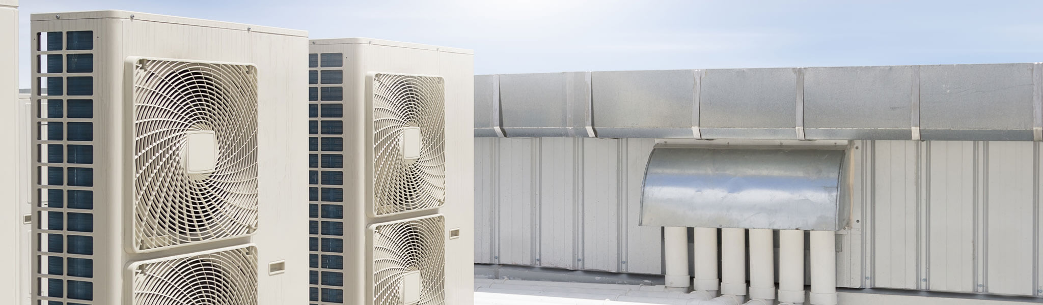 Condenser Unit Or Compressor On Roof Of Industrial Plant Buildin