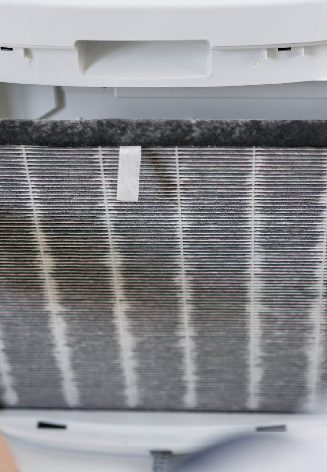 Asian Woman Changing The Dirty Air Purifier Filter After Using F