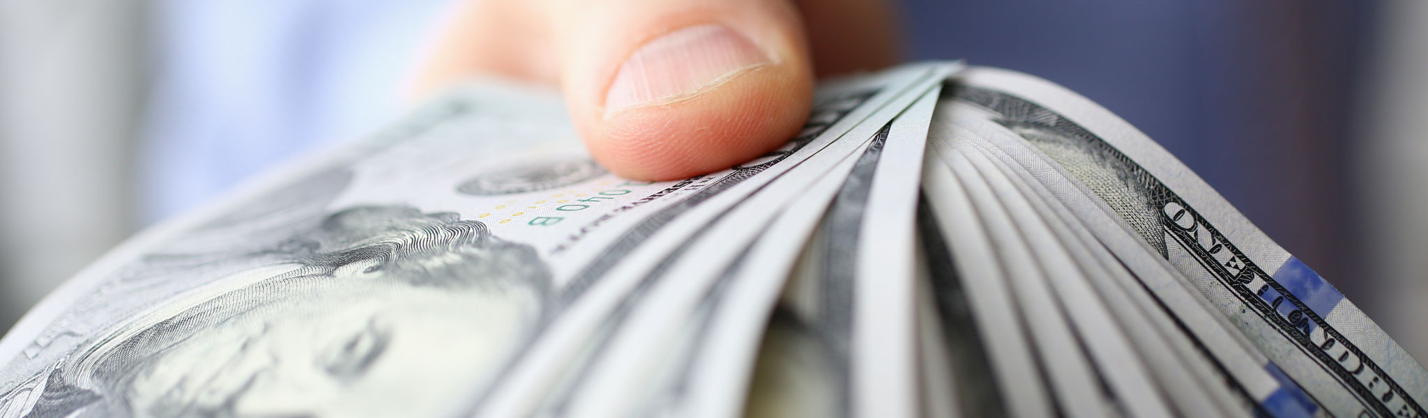 Hand Holding Out Money
